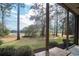 Peaceful backyard view from the screened porch, showcasing lush greenery at 366 Pinehurst Ln. # 13D, Pawleys Island, SC 29585