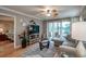 Open living room showcasing a sectional sofa, flat-screen TV and access to a bedroom at 366 Pinehurst Ln. # 13D, Pawleys Island, SC 29585