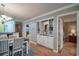 Dining area with built-in shelving and access to a hallway leading to other rooms at 366 Pinehurst Ln. # 13D, Pawleys Island, SC 29585