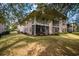 Exterior view showing a two-story building with screened porches at 366 Pinehurst Ln. # 13D, Pawleys Island, SC 29585