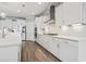 Modern kitchen with white cabinets, quartz countertops, and stainless steel appliances at 7129 Spoleto Dr., Myrtle Beach, SC 29572