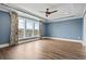 Bedroom with large windows and wood-look floors at 7129 Spoleto Dr., Myrtle Beach, SC 29572