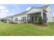 Home's back exterior showcasing a screened porch at 7129 Spoleto Dr., Myrtle Beach, SC 29572