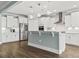 Open concept kitchen with island, white cabinets, and stainless steel appliances at 7129 Spoleto Dr., Myrtle Beach, SC 29572