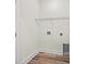 Bright laundry room with wire shelving and vinyl flooring at 1174 St. John Rd., Galivants Ferry, SC 29544