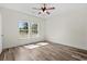 Well-lit bedroom with hardwood floors, ceiling fan, and ample natural light at 1174 St. John Rd., Galivants Ferry, SC 29544