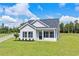 Single-story house with a blue door and landscaped yard at 1174 St. John Rd., Galivants Ferry, SC 29544