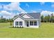 Single-story house with a blue door and landscaped yard at 1174 St. John Rd., Galivants Ferry, SC 29544