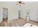 Spacious bedroom with bathroom access and wood-look floors at 1174 St. John Rd., Galivants Ferry, SC 29544