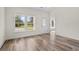 Bright entryway with vinyl plank flooring, leading to the kitchen and living areas at 1174 St. John Rd., Galivants Ferry, SC 29544
