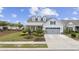 Gray house with a two-car garage, landscaping, and a front porch at 6438 Cascata Dr., Myrtle Beach, SC 29572