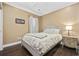 Cozy bedroom with a comfortable bed, nightstand, and window at 6438 Cascata Dr., Myrtle Beach, SC 29572