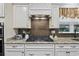 Gas cooktop, granite countertops, and white cabinets at 6438 Cascata Dr., Myrtle Beach, SC 29572