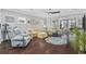 Bright and airy living room with comfortable seating and access to a screened porch at 6438 Cascata Dr., Myrtle Beach, SC 29572