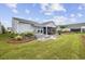 Charming house with a screened porch and well-manicured lawn at 6438 Cascata Dr., Myrtle Beach, SC 29572