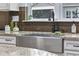 Farmhouse sink, granite countertops and a window at 6438 Cascata Dr., Myrtle Beach, SC 29572