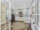 Home office with built-in shelving, hardwood floors, and French doors at 6438 Cascata Dr., Myrtle Beach, SC 29572