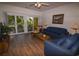 Comfortable living room with patio access, featuring two sofas and wicker accent chair at 601 N Hillside Dr. # 2123, North Myrtle Beach, SC 29582