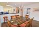 Dining area with glass-top table and chairs, adjacent to the kitchen and laundry area at 601 N Hillside Dr. # 2123, North Myrtle Beach, SC 29582
