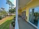 Private balcony with seating area and tennis court view at 601 N Hillside Dr. # 2123, North Myrtle Beach, SC 29582