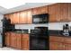 Full kitchen with black appliances and ample cabinetry at 1501 Ocean Blvd. S # 839, Myrtle Beach, SC 29577