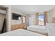 Guest bedroom with two double beds, TV, and ocean view at 1501 Ocean Blvd. S # 839, Myrtle Beach, SC 29577