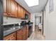 Well-equipped kitchen with dark wood cabinets and granite counters at 1501 Ocean Blvd. S # 839, Myrtle Beach, SC 29577