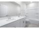 Bathroom with double vanity and bathtub at 623 Blackthorne Circle Nw, Calabash, NC 28467