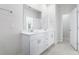 Double vanity bathroom with a modern white cabinet at 623 Blackthorne Circle Nw, Calabash, NC 28467