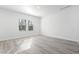 Spacious bedroom with large window and hardwood floors at 623 Blackthorne Circle Nw, Calabash, NC 28467