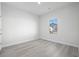 Simple bedroom with light gray walls and wood-look floors at 623 Blackthorne Circle Nw, Calabash, NC 28467