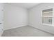 Simple bedroom with carpet flooring and a window at 623 Blackthorne Circle Nw, Calabash, NC 28467