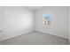 Simple bedroom with carpet flooring and a window at 623 Blackthorne Circle Nw, Calabash, NC 28467