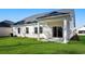 House exterior showcasing backyard and covered patio at 623 Blackthorne Circle Nw, Calabash, NC 28467