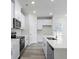 Modern kitchen with stainless steel appliances and white cabinets at 623 Blackthorne Circle Nw, Calabash, NC 28467