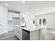Open concept kitchen with island and stainless steel appliances at 623 Blackthorne Circle Nw, Calabash, NC 28467