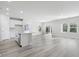 Open concept kitchen with island and stainless steel appliances at 623 Blackthorne Circle Nw, Calabash, NC 28467