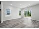 Bright living room with sliding glass doors to backyard at 623 Blackthorne Circle Nw, Calabash, NC 28467