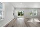 Spacious living area with hardwood floors and natural light at 623 Blackthorne Circle Nw, Calabash, NC 28467