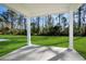 Covered patio overlooking a grassy backyard at 623 Blackthorne Circle Nw, Calabash, NC 28467