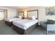 Hotel bedroom with two double beds and armchair at 1105 S Ocean Blvd. # 1138, Myrtle Beach, SC 29577