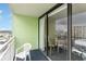 Balcony with chairs and partial ocean view at 1105 S Ocean Blvd. # 1138, Myrtle Beach, SC 29577