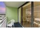 Balcony with chairs and partial ocean view at 1105 S Ocean Blvd. # 1138, Myrtle Beach, SC 29577