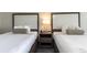 Hotel bedroom with two beds and nightstand with lamp at 1105 S Ocean Blvd. # 1138, Myrtle Beach, SC 29577
