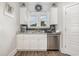 Bright kitchen features a stylish sink and updated cabinetry at 1886 Southwood Dr., Myrtle Beach, SC 29575