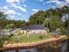 Aerial view of waterfront home with dock and landscaping at 1886 Southwood Dr., Myrtle Beach, SC 29575