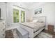 Serene bedroom with a queen bed, and a window overlooking the backyard at 1886 Southwood Dr., Myrtle Beach, SC 29575