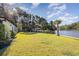 Spacious backyard with gazebo, lush lawn, and waterfront access at 1886 Southwood Dr., Myrtle Beach, SC 29575
