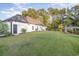 Modern house exterior with a large backyard and lush greenery at 1886 Southwood Dr., Myrtle Beach, SC 29575