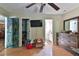 Main bedroom with wood floors and en-suite bathroom access at 7990 Short Needle Ct., Murrells Inlet, SC 29576